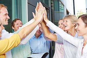 Team High-Five Büro Team macht High-Five